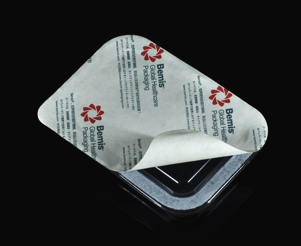 医疗器械使用的透明吸塑盒与盖材是怎么密封上去的呀?